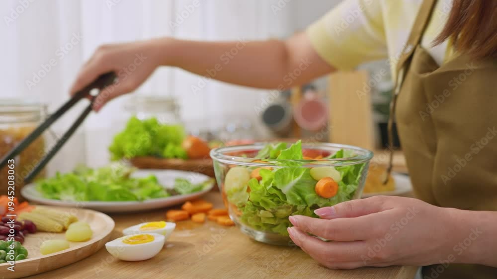 Close up of woman cooking healthy foods in kitchen in morning at home. Close up of woman cooking healthy foods in kitchen in morning at home.