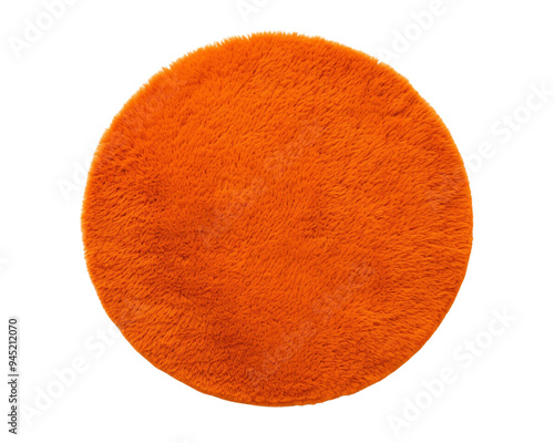 A vibrant orange round rug adds warmth and style to any interior space, PNG