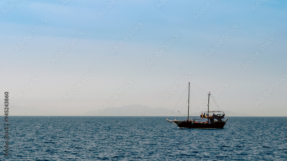 black yacht in the Red Sea on the background of the island black yacht in the Red Sea on the background of the island