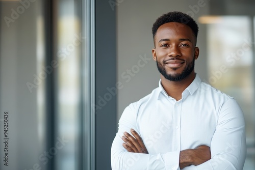 Confident African American Male Consultant Posing by Modern Office Window