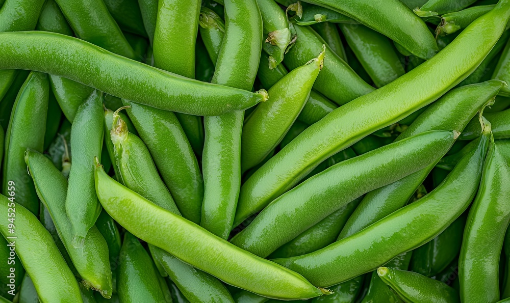 A close-up of fresh green snap peas, showcasing their vibrant color and natural texture. A close-up of fresh green snap peas, showcasing their vibrant color and natural texture.