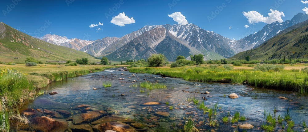 Majestic Rocky Mountain Range with Crystal Clear River Flowing in the Valley Majestic Rocky Mountain Range with Crystal Clear River Flowing in the Valley