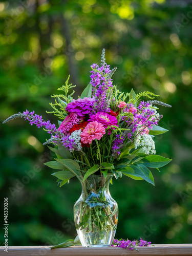 Flower meadow under a clear summer sky in color field