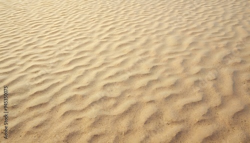 Sand texture on a beach with natural patterns and fine grains. Ideal for nature and relaxation-related projects.