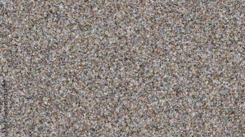 A close-up view of a textured surface resembling sand or gravel.