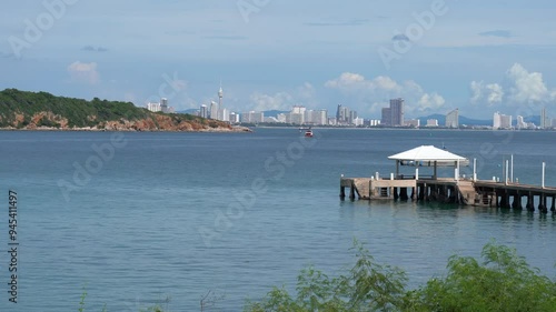 Pier on the north east side of thei island of Koh Larn, with a view on the island of Ko Khrok and the Pattaya skyline in the background, Thailand photo