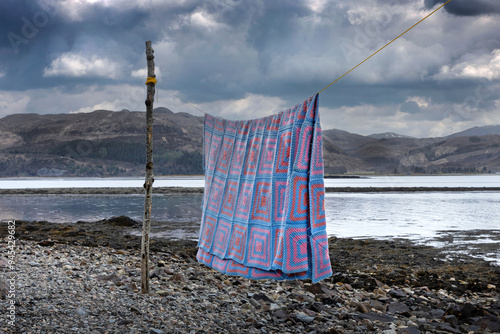 Drying blanket on a washing line. At Lochcarron. Scottisch Highlands. Lake.  photo