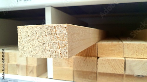 Wooden block close-up in a hardware store on a shelf. Wooden blocks for construction, repair, interior.  Wooden board, new boards in a hardware store. Wood products, lumber, stack of boards.