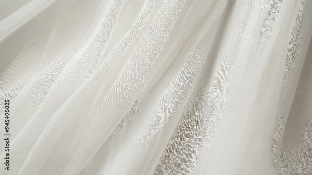 Obraz premium Close-up of a minimalist bridal dress, showcasing delicate details and pure white fabric, with a simple, uncluttered background, emphasizing elegance, no people.
