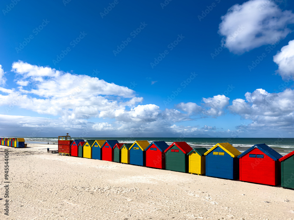 The iconic Muizenberg Beach huts for people to change in and out of bathing suits situated on Muizenberg Beach, Cape Town, South Africa The iconic Muizenberg Beach huts for people to change in and out of bathing suits situated on Muizenberg Beach, Cape Town, South Africa