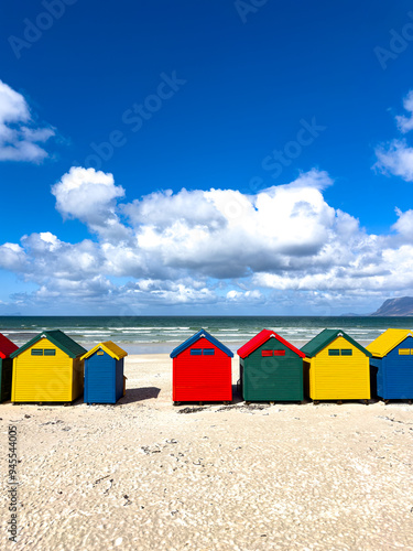 The iconic Muizenberg Beach huts for people to change in and out of bathing suits situated on Muizenberg Beach, Cape Town, South Africa