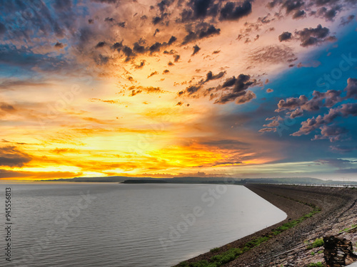 Landscape shot of a lake, hills, trees shot against a beautiful sunset. Scenic view from Mahi Dam at Banswara
 photo