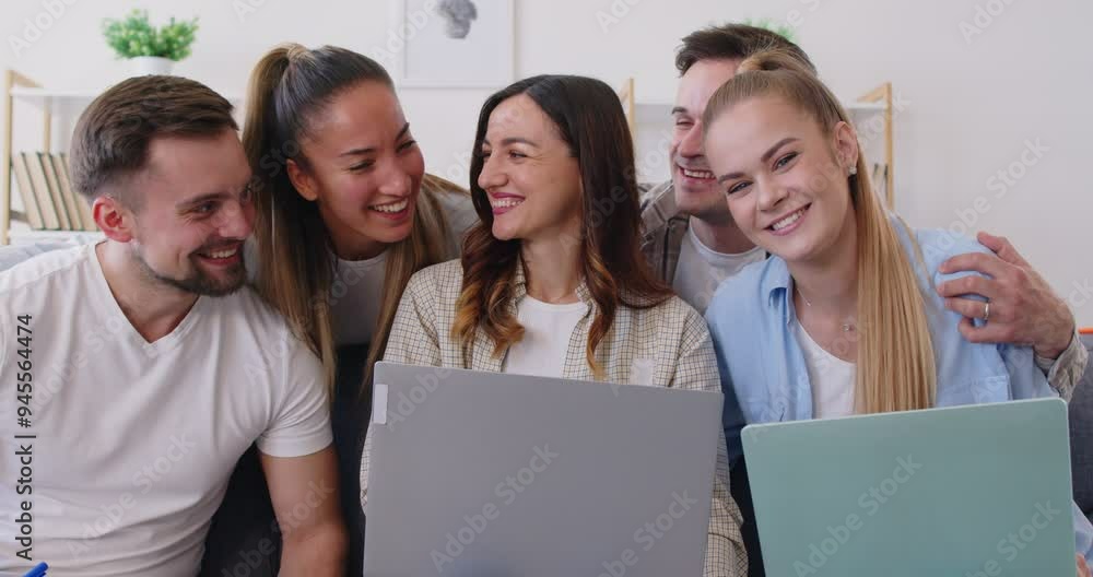 Diverse team of coworkers or students poses for a group portrait, smiling together and embracing each other. Happiness highlight a sense of victory and camaraderie between cheerful people. Diverse team of coworkers or students poses for a group portrait, smiling together and embracing each other. Happiness highlight a sense of victory and camaraderie between cheerful people.