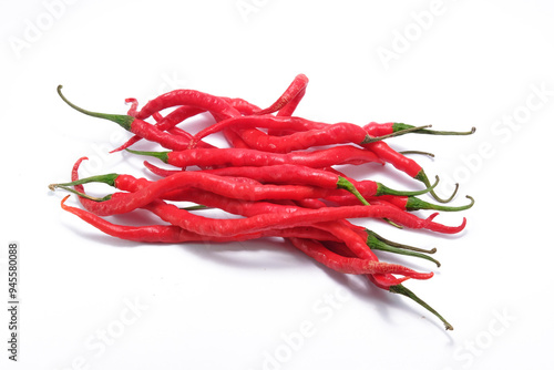 red chili peppers stacked on white background photo