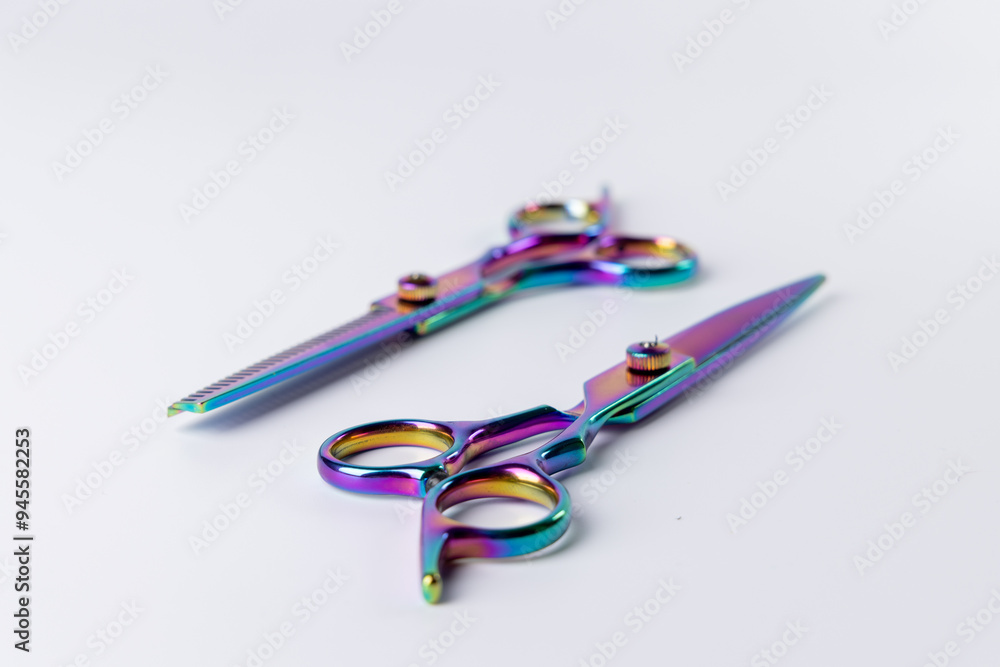 Two scissors centrally placed on a plain white background. Two scissors centrally placed on a plain white background.