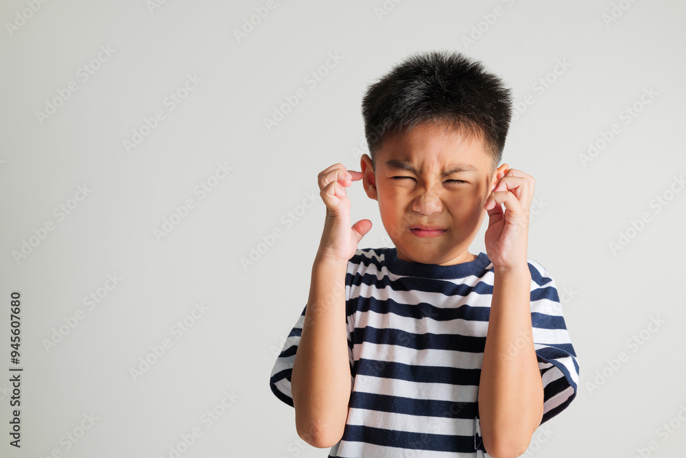 Asian portrait young kid boy standing angry and mad raising fist frustrated and furious while shouting with anger isolated, studio shot on white background, primary child not happy Asian portrait young kid boy standing angry and mad raising fist frustrated and furious while shouting with anger isolated, studio shot on white background, primary child not happy