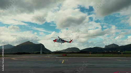 ambulance helicopter lands in the mountains photo