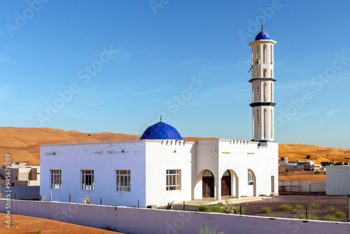 Mosque in city of Al Raqa among sand and sand dunes. Sultanate of Oman photo