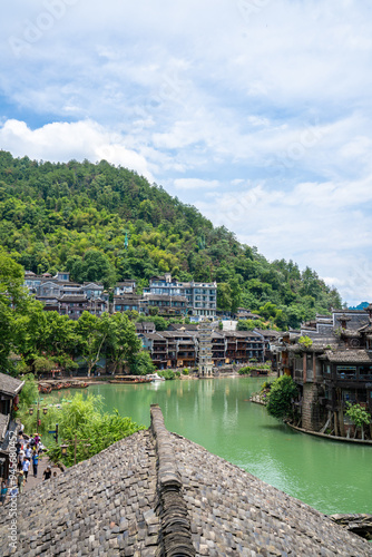 Traditional Miao Architecture and Mountainous Scenery in Fenghuang Ancient Town, Hunan Xiangxi photo