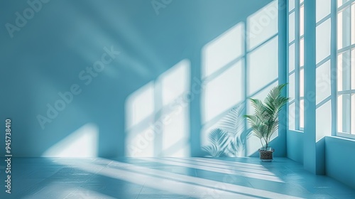 A minimalist, light blue abstract background for product presentation, featuring window shadows and light on the wall