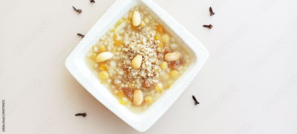 Ashura or Ashura dessert made with legumes and dried fruits on a white background Ashura or Ashura dessert made with legumes and dried fruits on a white background