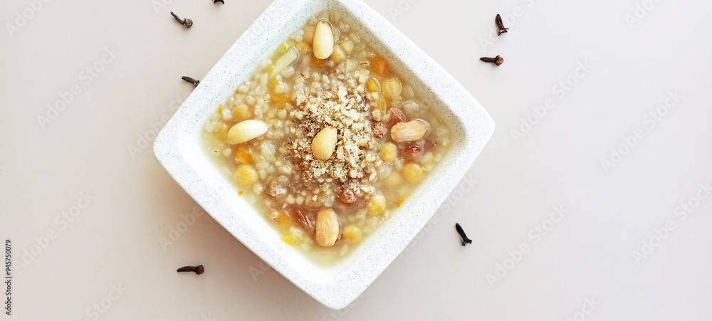 Ashura or Ashura dessert made with legumes and dried fruits on a white background Ashura or Ashura dessert made with legumes and dried fruits on a white background