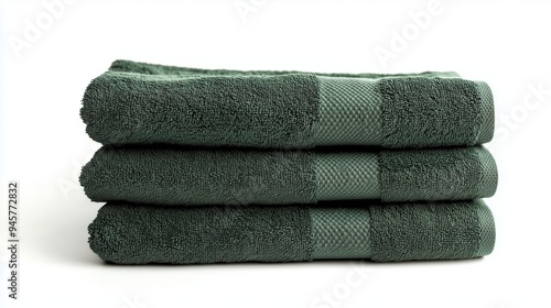 Stack of green towels on white background, isolated