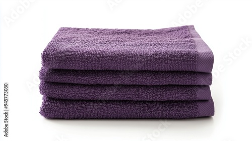 Stack of purple towels on a white background, isolated