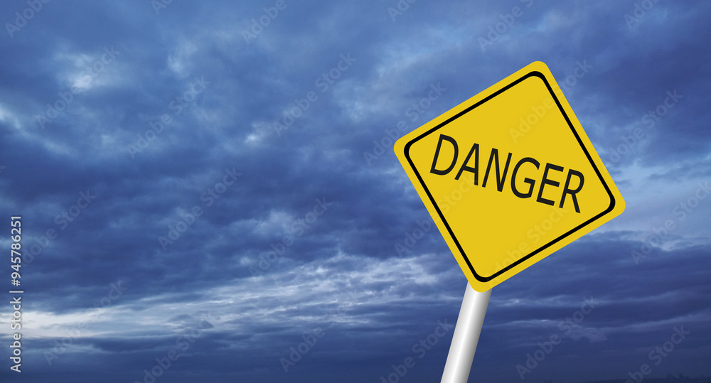 Naklejka premium danger,Hurricane Idalia warning sign against a powerful stormy background with copy space. Dirty and angled sign with cyclonic winds add to the drama.hurricane season sign on cloudy background