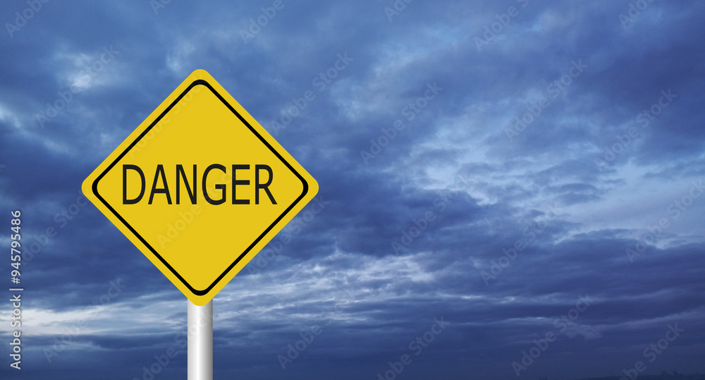 Naklejka premium danger,Hurricane Idalia warning sign against a powerful stormy background with copy space. Dirty and angled sign with cyclonic winds add to the drama.hurricane season sign on cloudy background