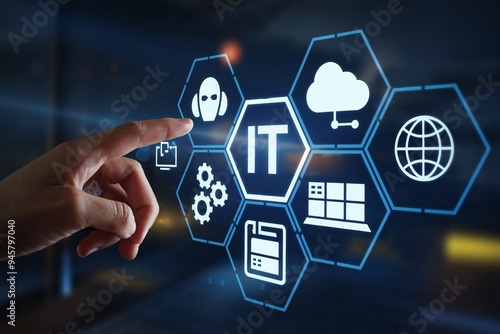 IT Solutions at Your Fingertips: A hand interacts with a holographic interface showcasing IT services, emphasizing innovation in technology and support. 