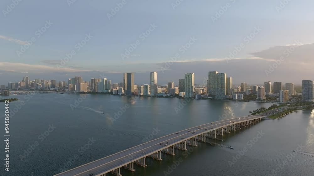 Aerial view of biscayne bay with modern skyline and julia tuttle causeway at sunset, miami, united states. Aerial view of biscayne bay with modern skyline and julia tuttle causeway at sunset, miami, united states.
