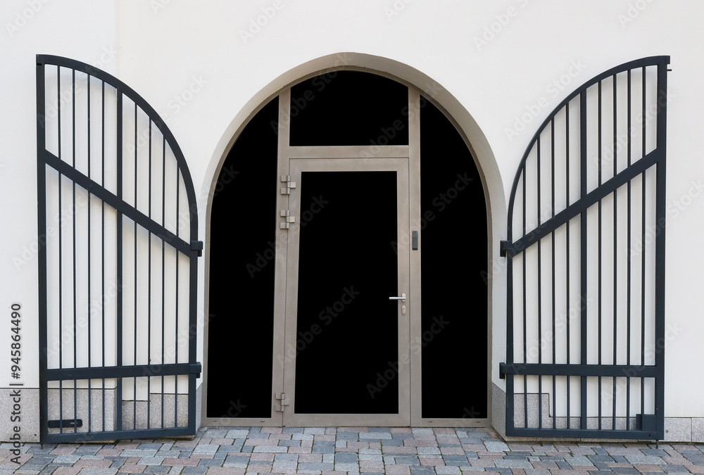 Modern arched door with steel security bars Modern arched door with steel security bars