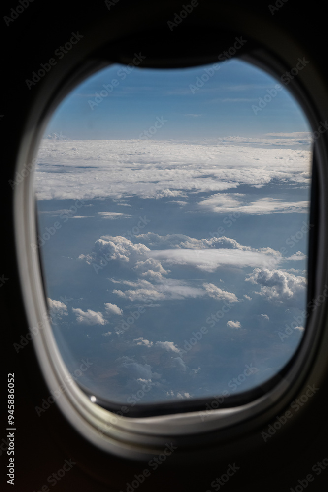 View of clouds and horizon from plane window. View of clouds and horizon from plane window.
