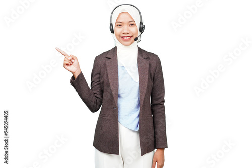 Smiling asian hijab girl customer service pointing at the blank space isolated transparent photo