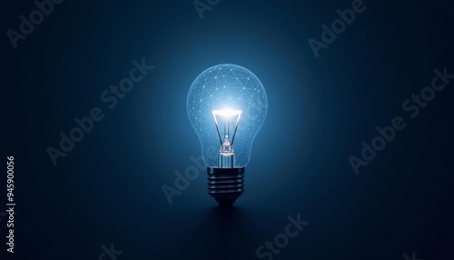 Illuminating Idea  A single light bulb glowing brightly against a dark background