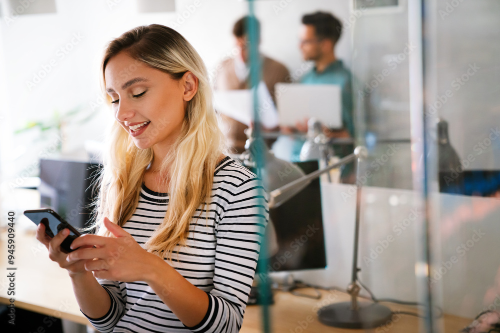 Successful young business woman standing in creative modern office. Success woman concept. Successful young business woman standing in creative modern office. Success woman concept.