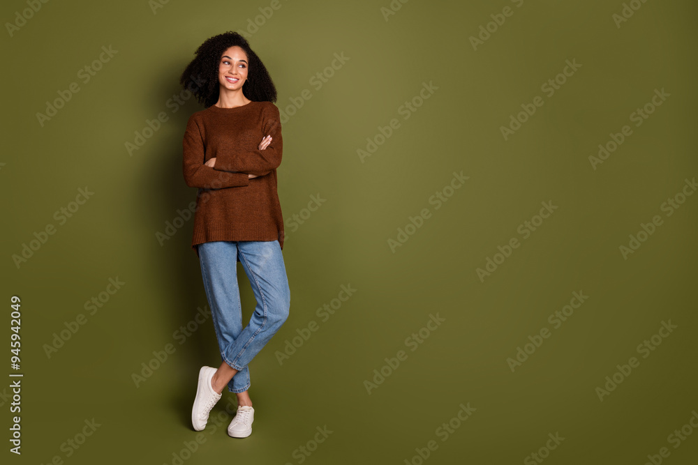 Full length portrait of pretty young woman folded hands look empty space wear sweater isolated on khaki color background Full length portrait of pretty young woman folded hands look empty space wear sweater isolated on khaki color background