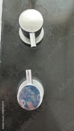Bali Indonesia: close up of a water temperature controller on bathub 