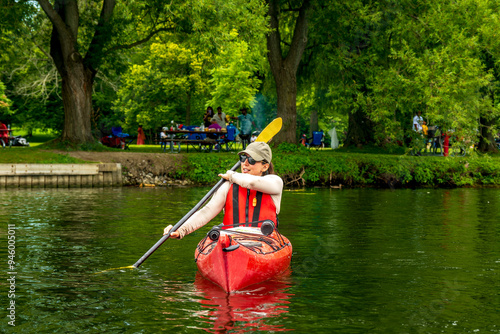 Εκτύπωση καμβά Healthy outdoor lifestyle: Sea kayaker (woman, middle-aged, hat, sunglasses) on