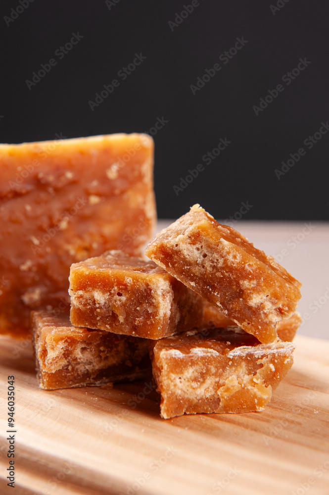 Typical sweet from northeastern Brazil made from sugar cane called Rapadura. Copy space. Selective focus Typical sweet from northeastern Brazil made from sugar cane called Rapadura. Copy space. Selective focus