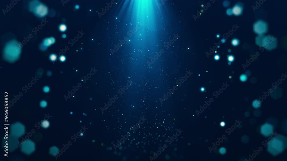 Abstract particles with glowing beams from above surrounded by bokeh on dark blue background. Abstract particles with glowing beams from above surrounded by bokeh on dark blue background.