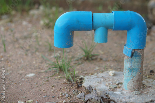 Blue PVC pipe installed on ground, used as a pipe to drain gas from toilets in houses or buildings. Gas disposal pipe. Concept, wisdom to  do toilet system in local house.    photo