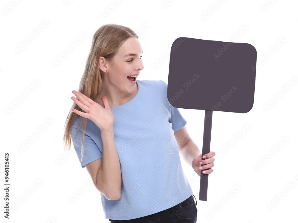 Vivacious young woman winking and laughing as she points at a blank signboard with copy space. Vivacious young woman winking and laughing as she points at a blank signboard with copy space.