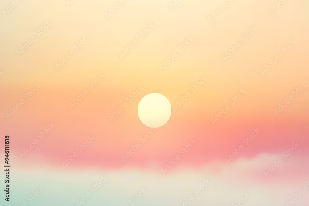 A hazy sunrise with a soft white sun in a muted pink and orange sky. A hazy sunrise with a soft white sun in a muted pink and orange sky.