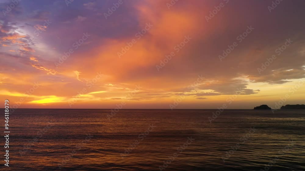 Aerial view of serene sunset over the tranquil ocean with beautiful clouds and warm hues, Fiji location. Aerial view of serene sunset over the tranquil ocean with beautiful clouds and warm hues, Fiji location.