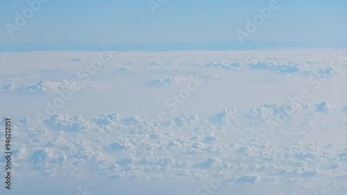 Natural abstract clouds background with white texture with Cumulus and blue hirizon of sky - aerial view over cloudy sky. Topics: weather, meteorology, space, atmosphere, air travel photo