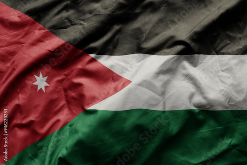 waving colorful realistic national flag of jordan . photo