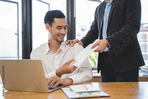 Fényképezés Good job, asian manager man giving financial reward in an envelope, business let