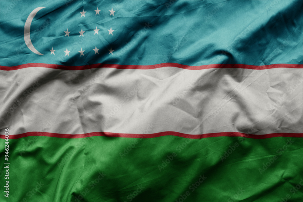 Obraz premium waving colorful realistic national flag of uzbekistan .